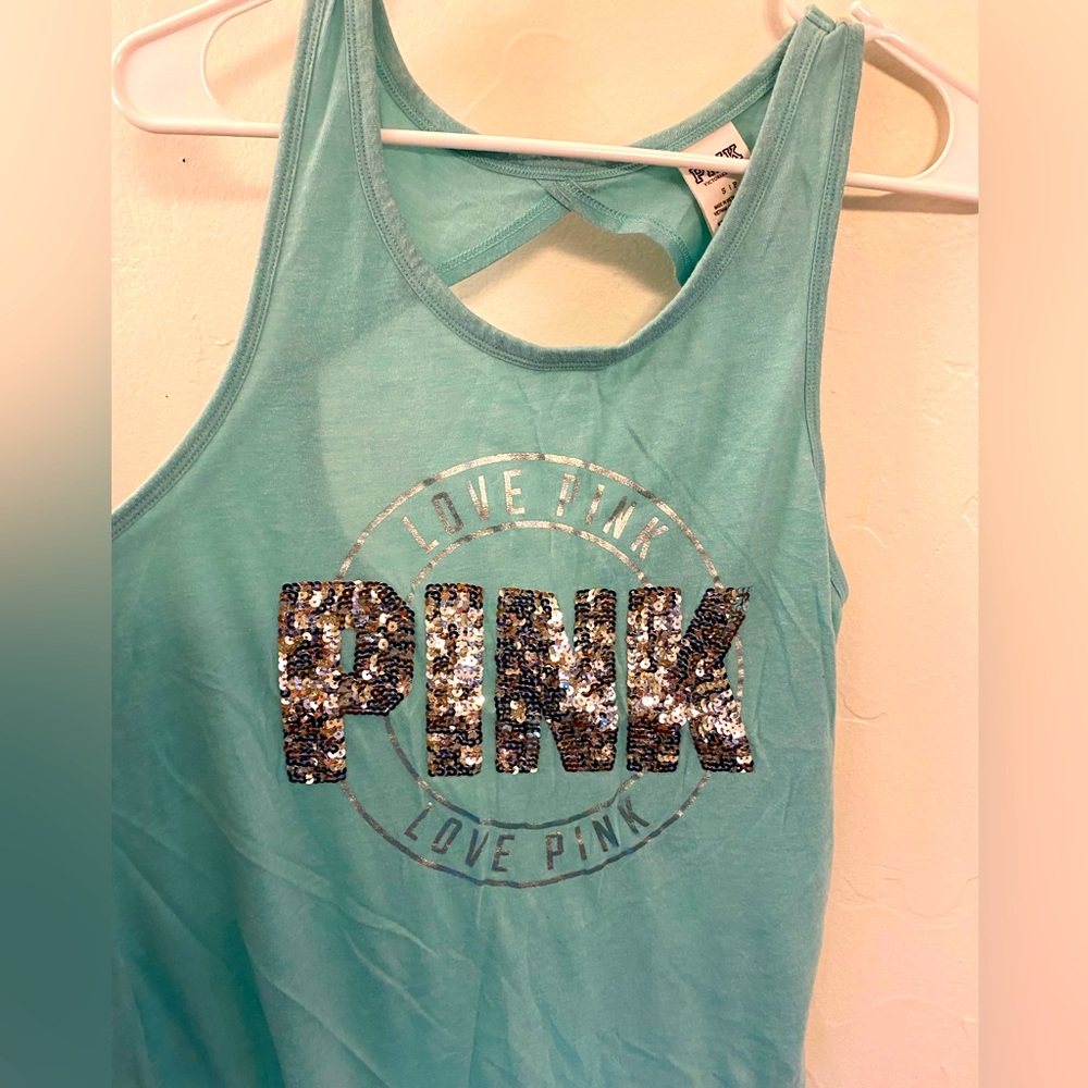 Pink tank with open cut-out in back in small